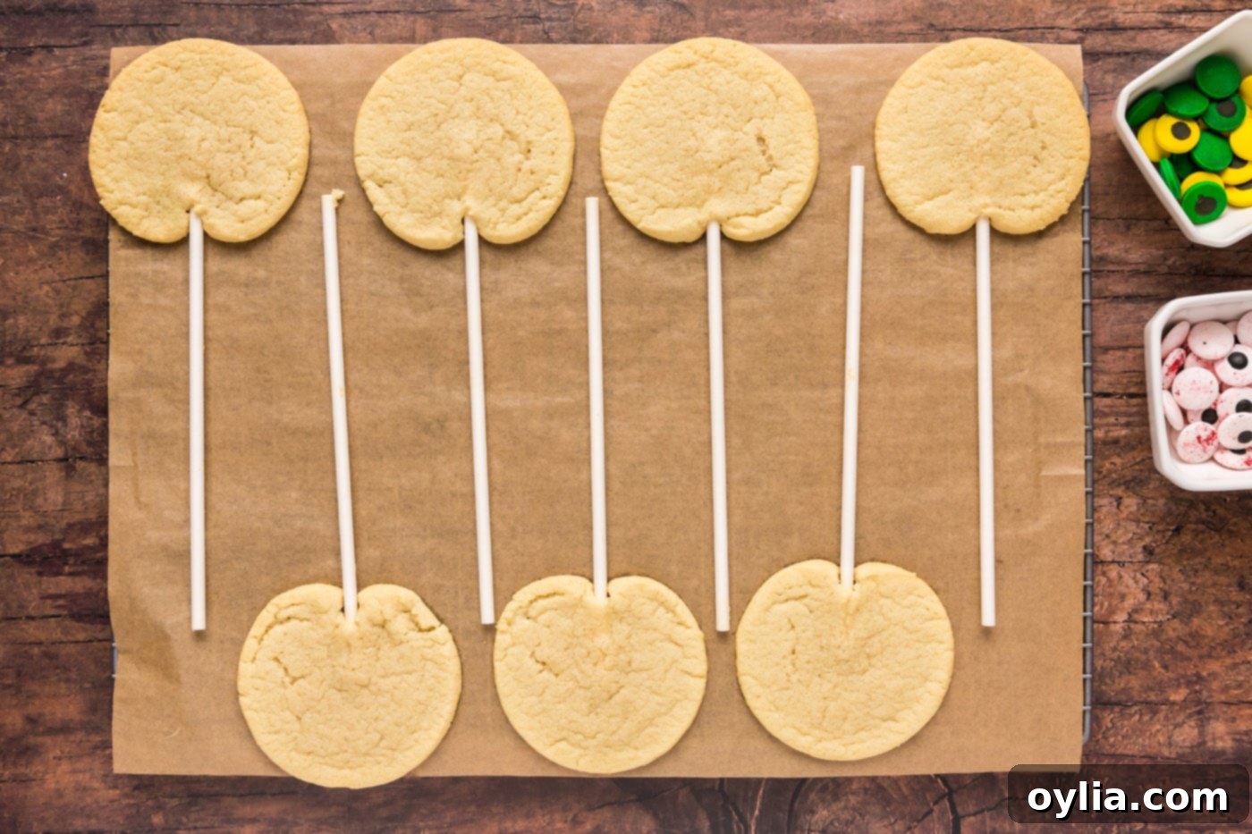 Baked cookie pops cooling on a wire rack