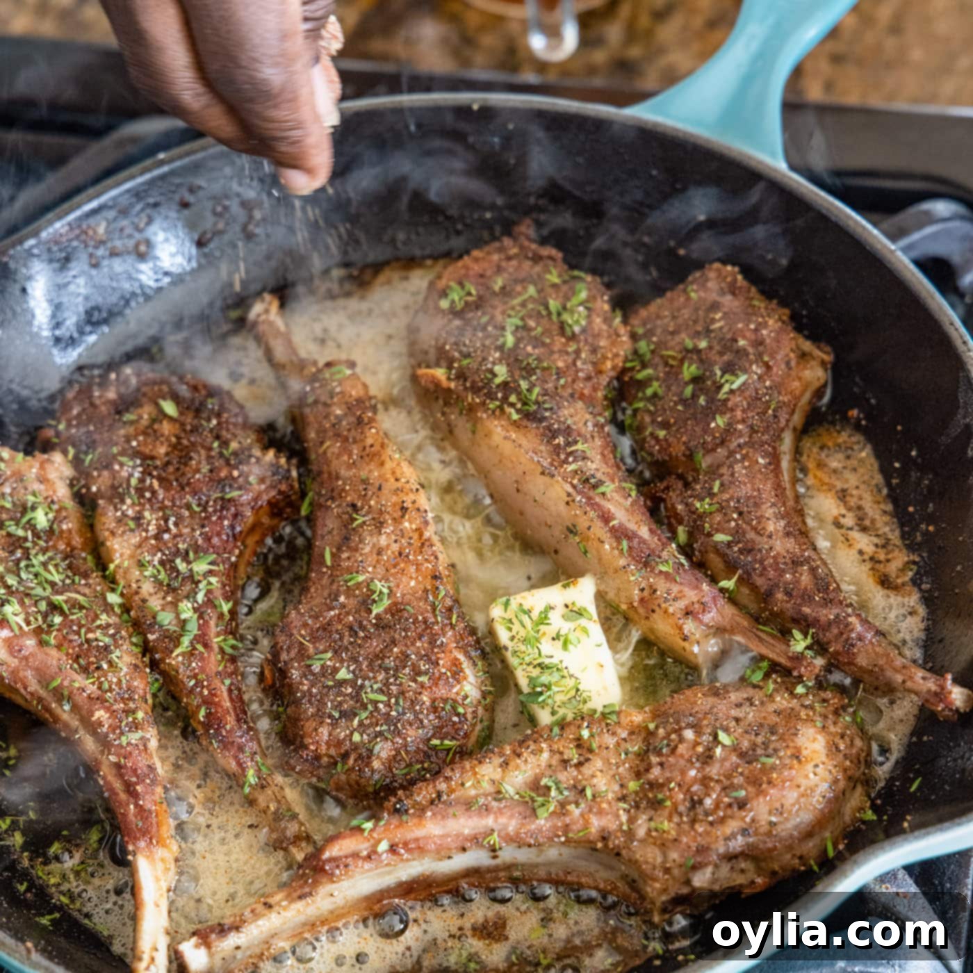butter and thyme on lamb chops