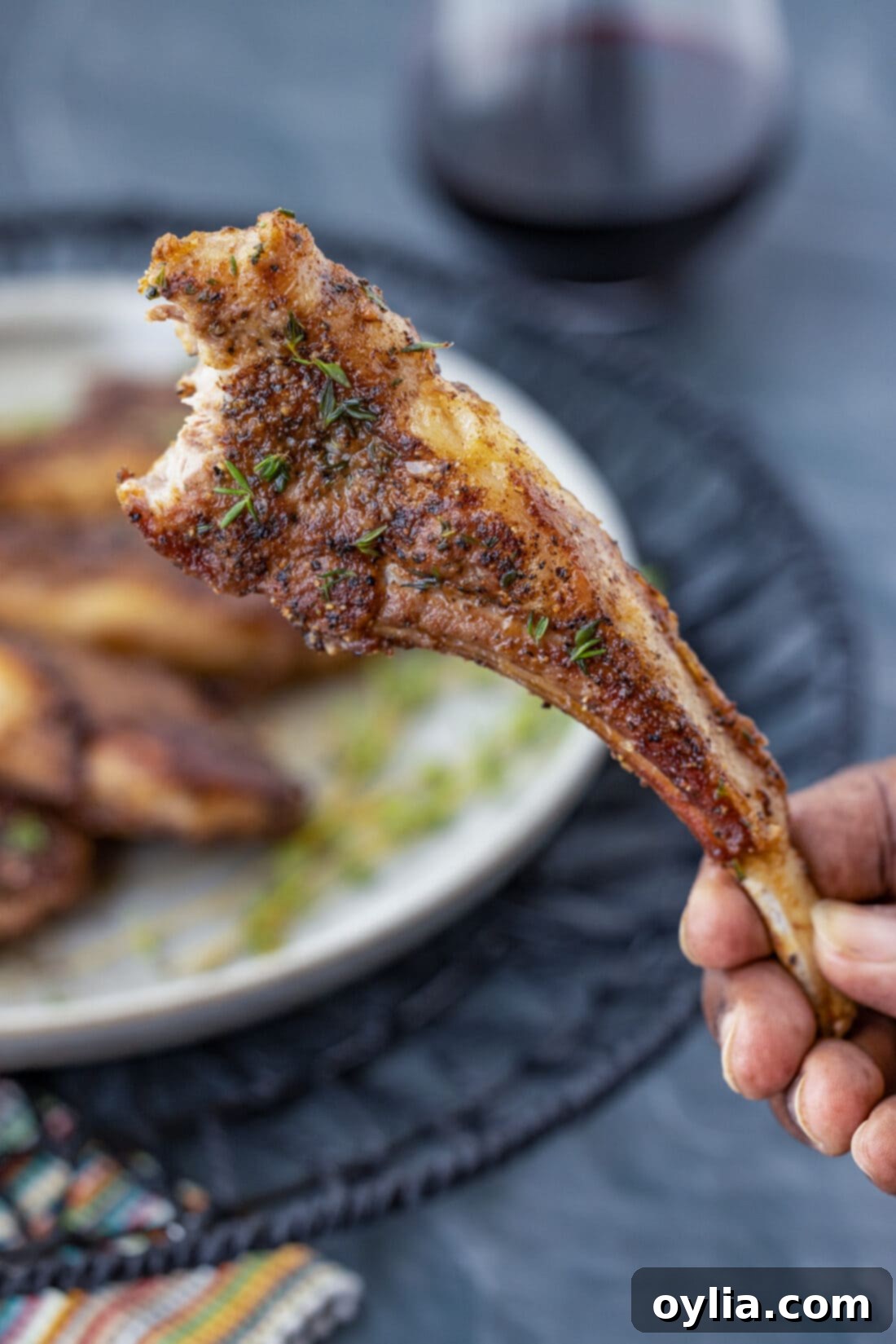 hand holding a Lollipop Lamb Chop