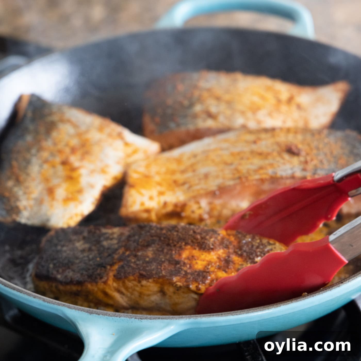 blackened salmon cooked in a skillet