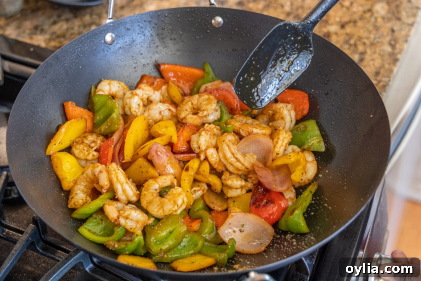cooked shrimp and veggies in a skillet