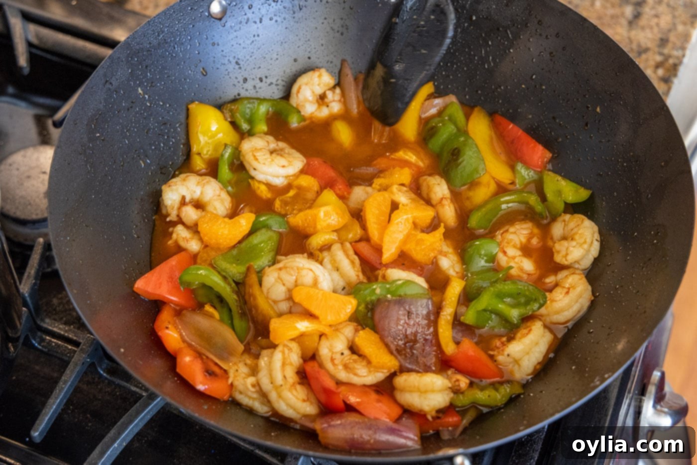 citrus pepper shrimp in a wok