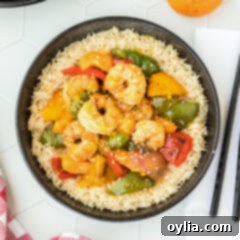 Citrus Pepper Shrimp in a bowl with chopsticks