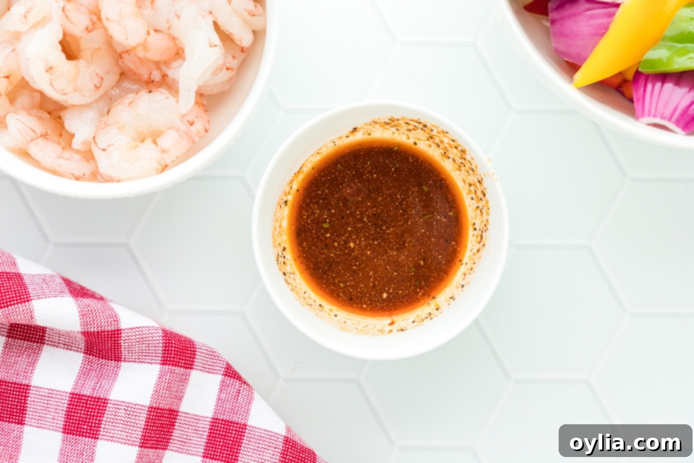 olive oil, cayenne pepper, black pepper, and garlic salt in a bowl