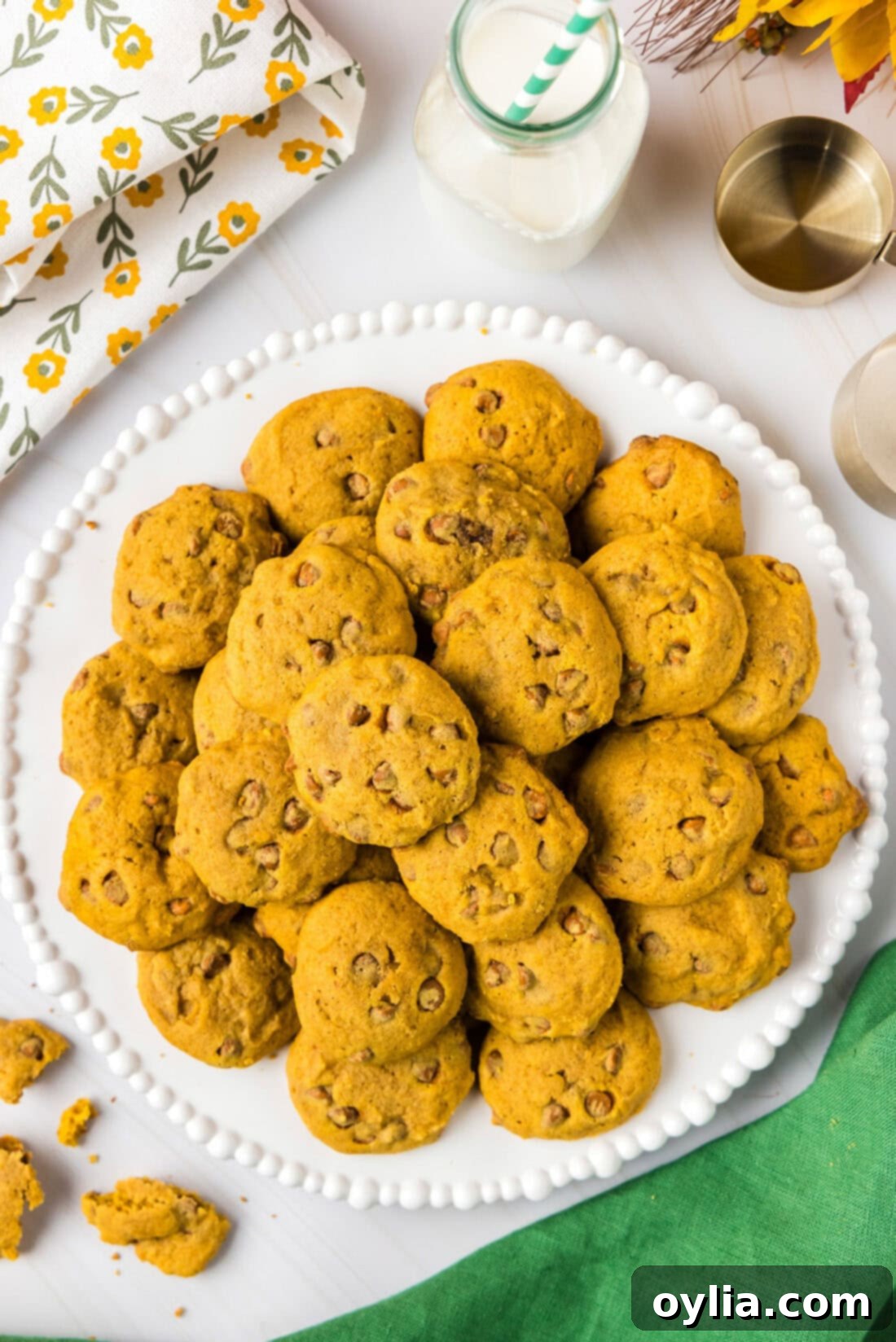 Delicious pumpkin cinnamon chip cookies piled high, promising a soft and chewy texture.