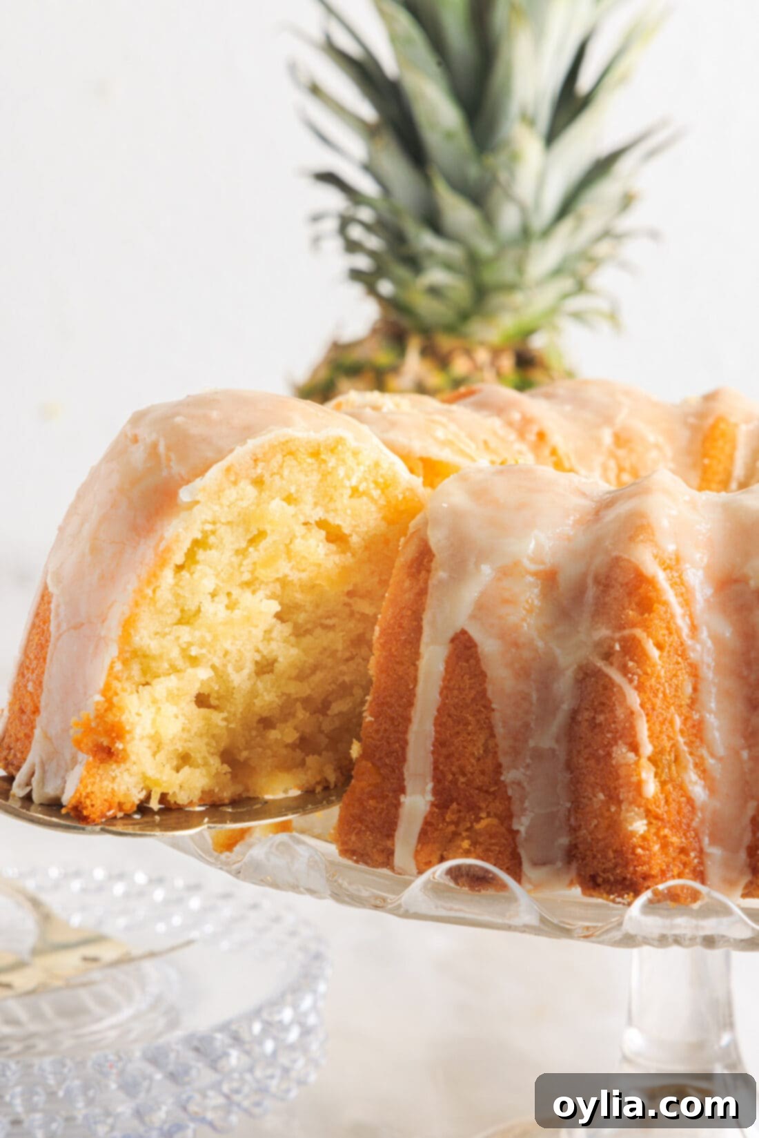 Pineapple Pound Cake with a slice removed, showing its moist interior