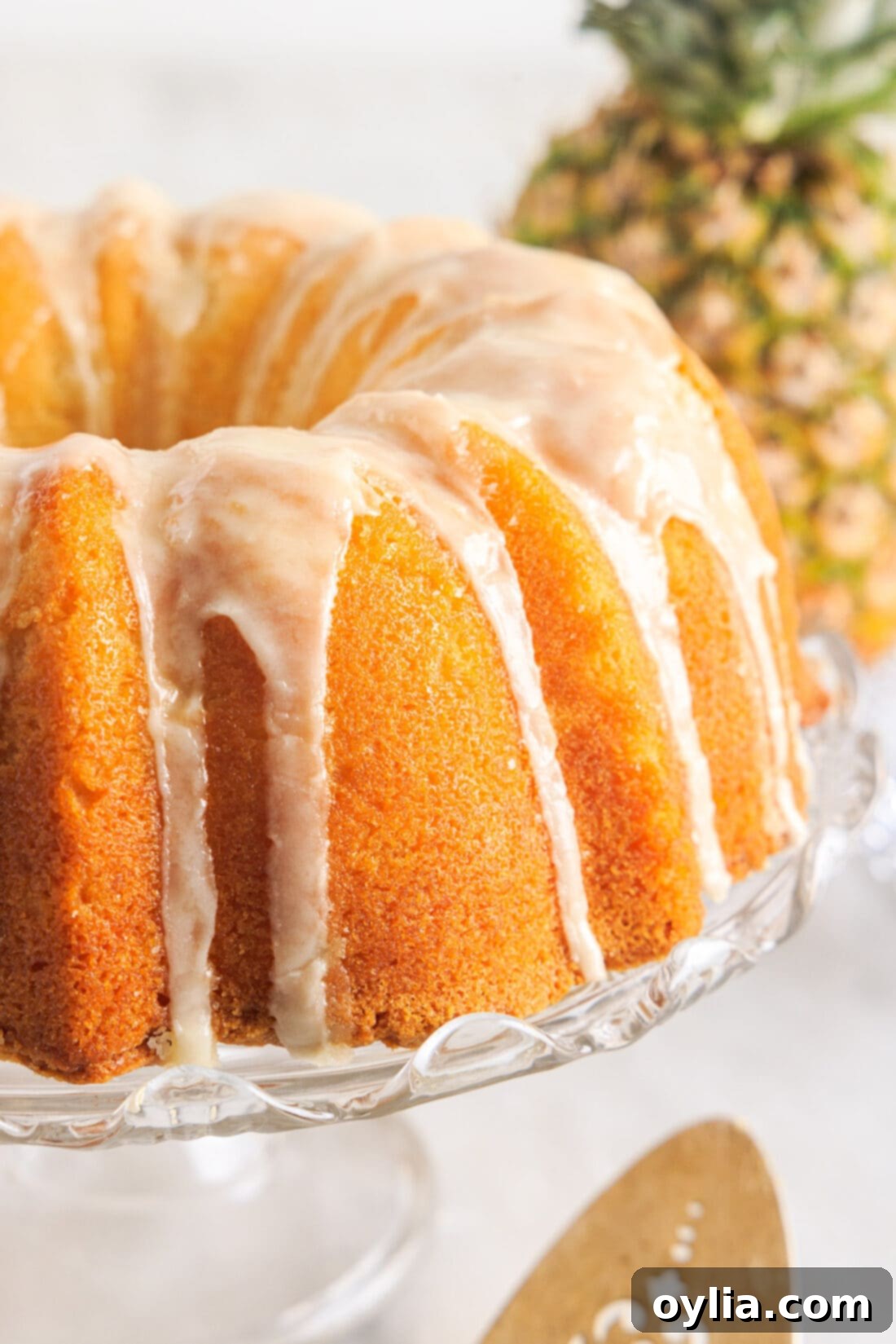 Whole Pineapple Pound Cake on a elegant cake plate, ready to be served