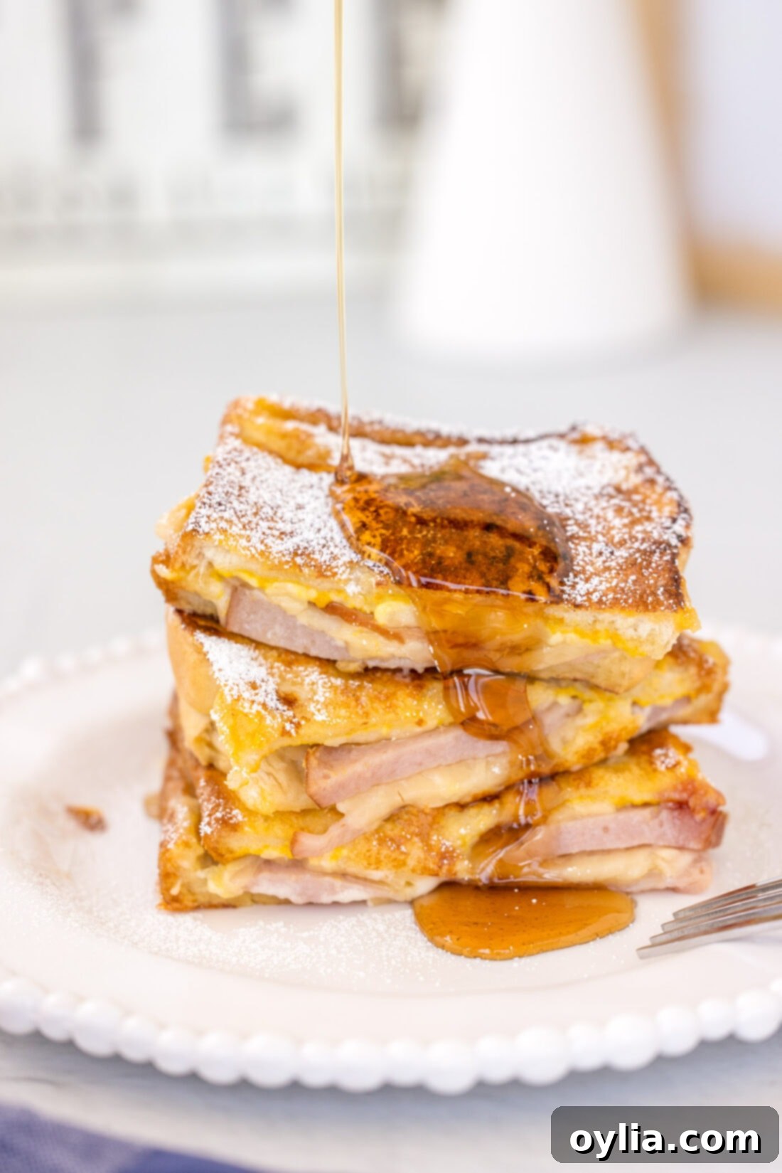 stack of Monte Cristo Sandwich with syrup