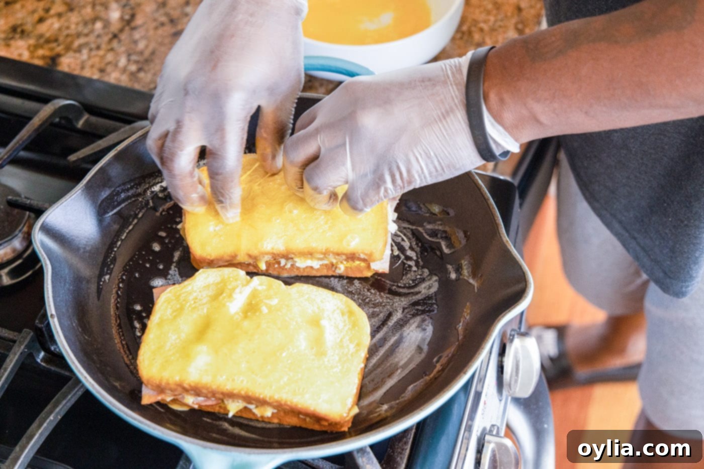 frying monte cristo sandwich in skillet with butter