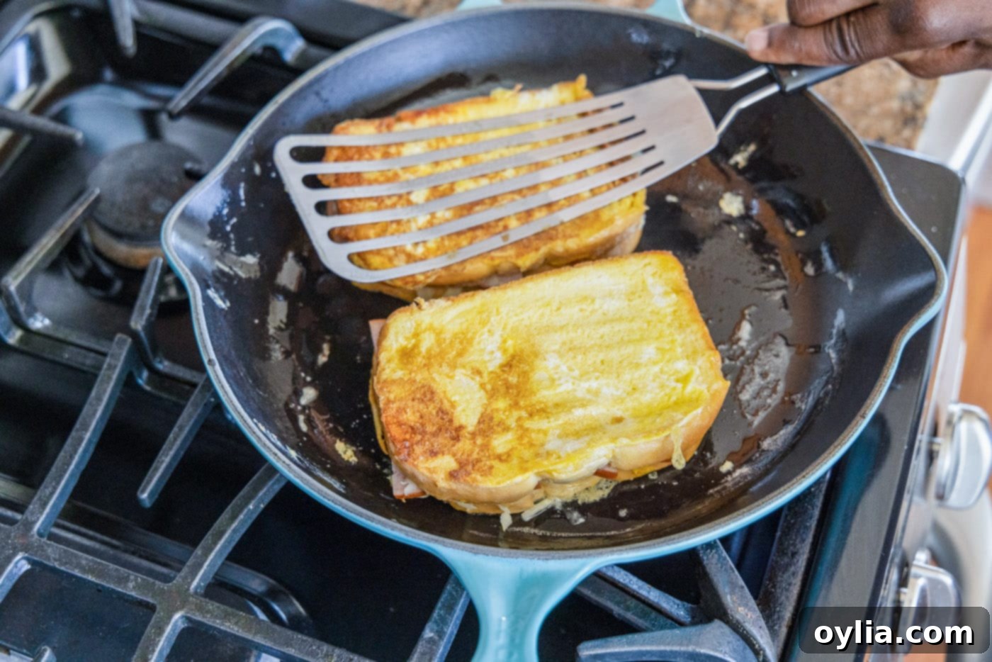 frying a monte cristo sandwich in a skillet