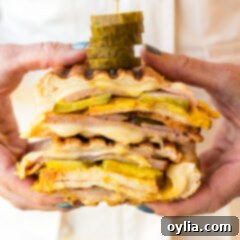 A stunning close-up of a Cuban Sandwich, golden and perfectly pressed