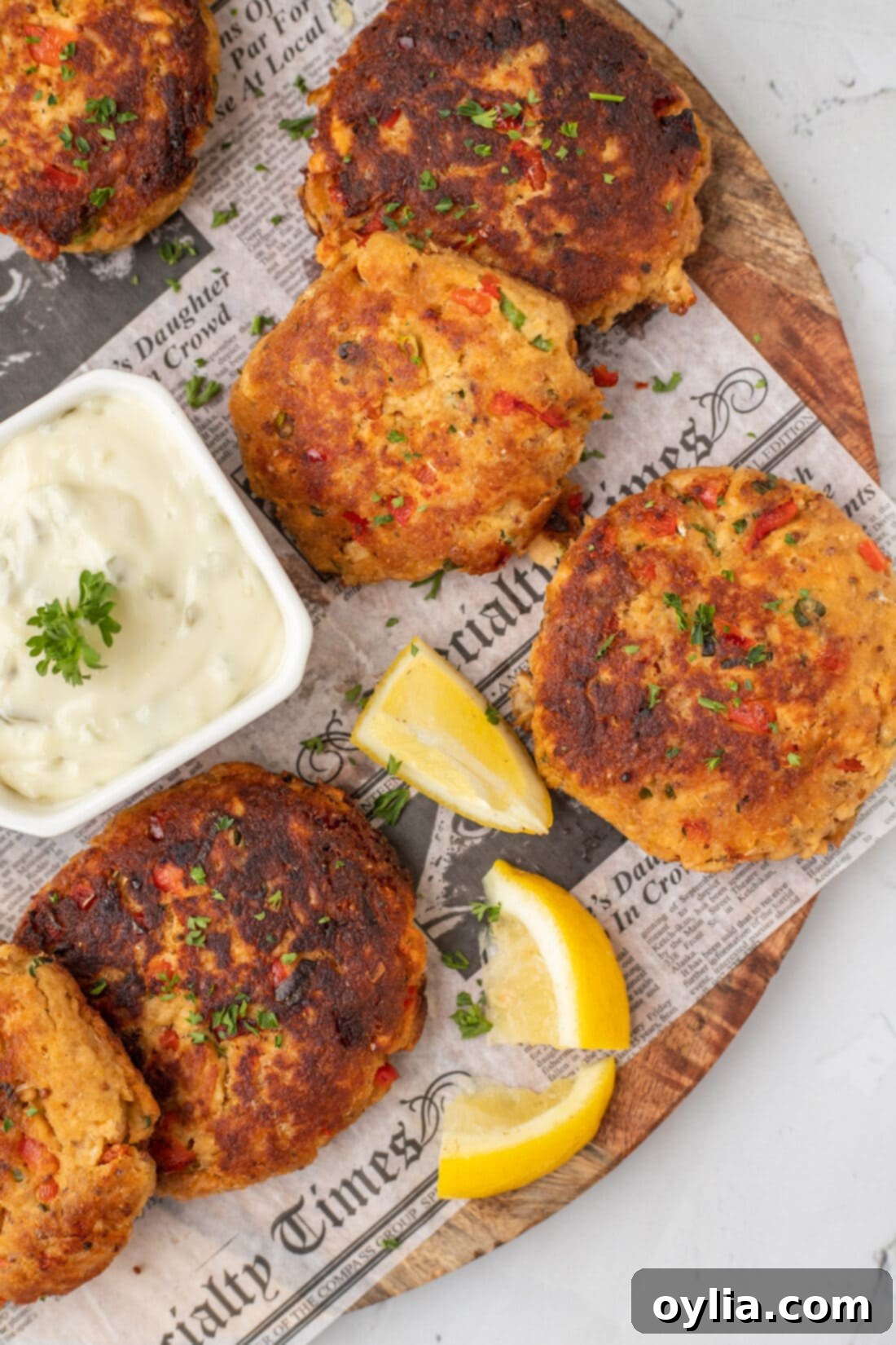 Crispy Golden Salmon Croquettes 2 Crispy Salmon Croquettes on parchment paper, ready to be served