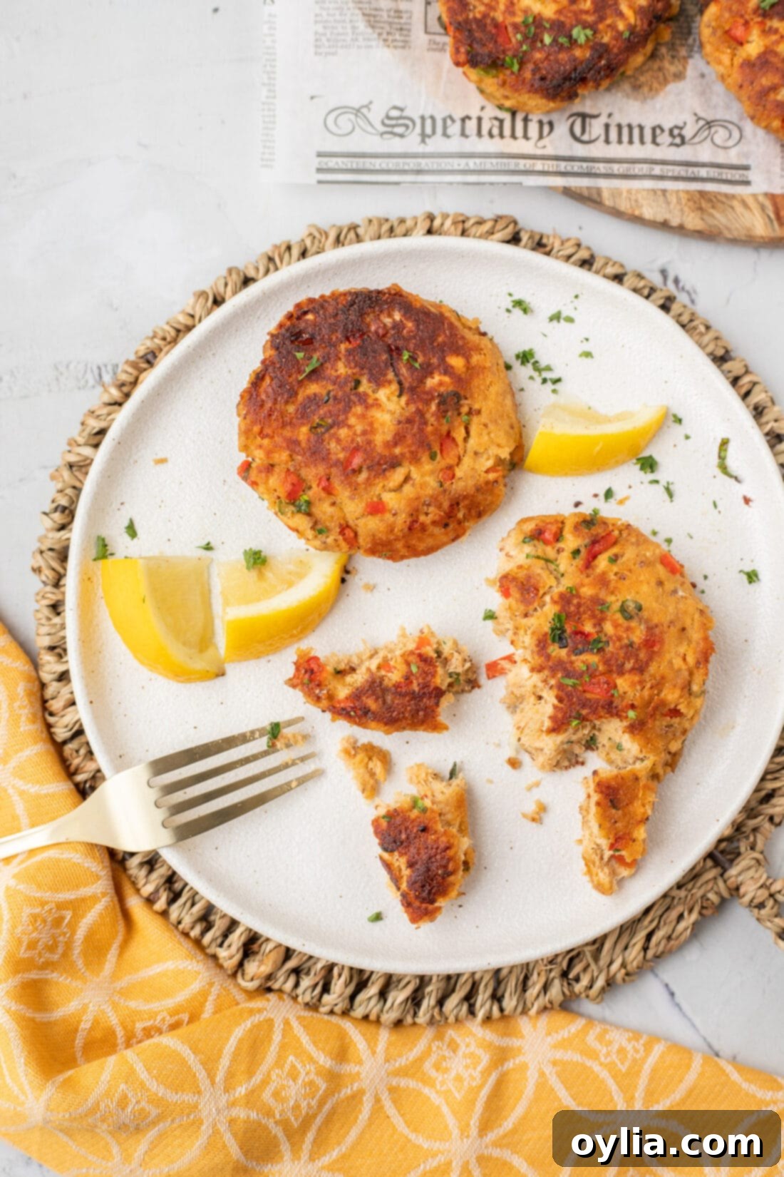 Crispy Golden Salmon Croquettes 3 Cooked Salmon Croquettes plated with a side of sauce