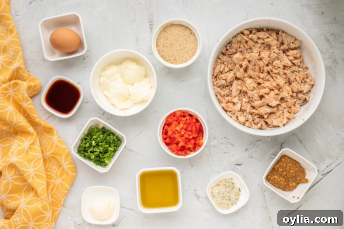 Crispy Golden Salmon Croquettes 4 A flat lay of ingredients for Salmon Croquettes including canned salmon, bell peppers, green onions, and various sauces
