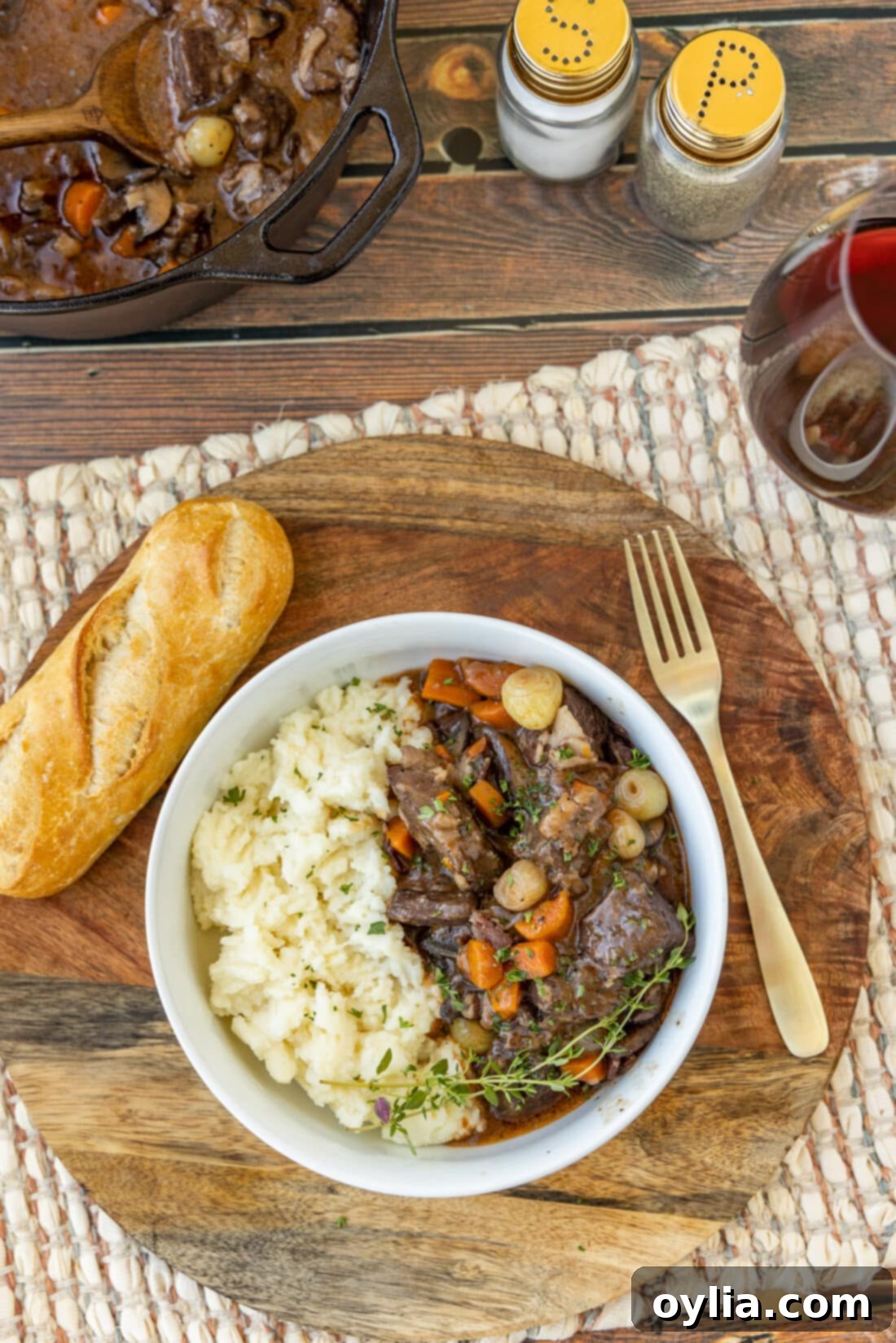 Bowl of Beef Bourguignon with creamy mashed potatoes, ready to serve