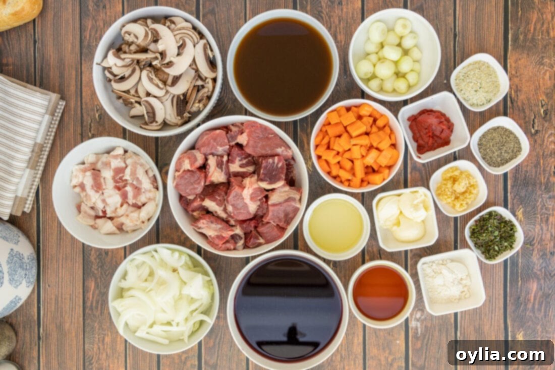 Arrangement of fresh ingredients for Beef Bourguignon: beef, bacon, vegetables, and wine