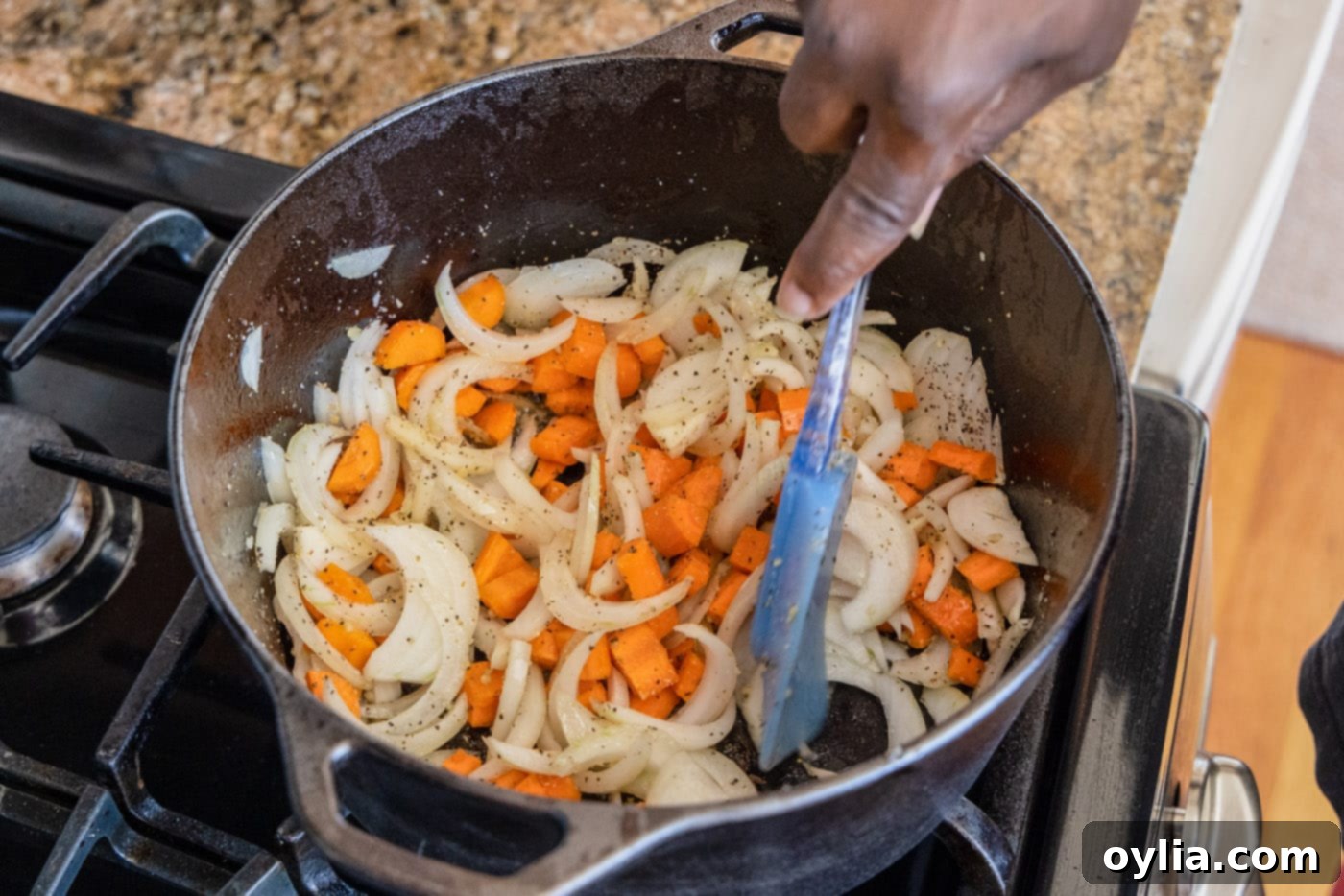 Sautéing onion, garlic, and carrots in a Dutch oven for the bourguignon base