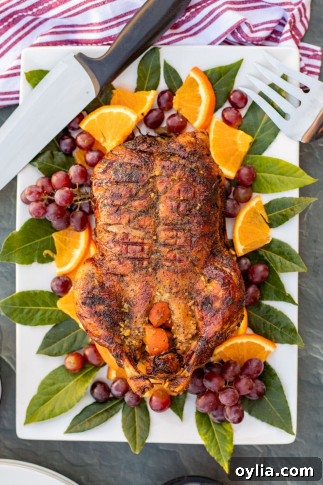 Roast Duck on a platter with a knife