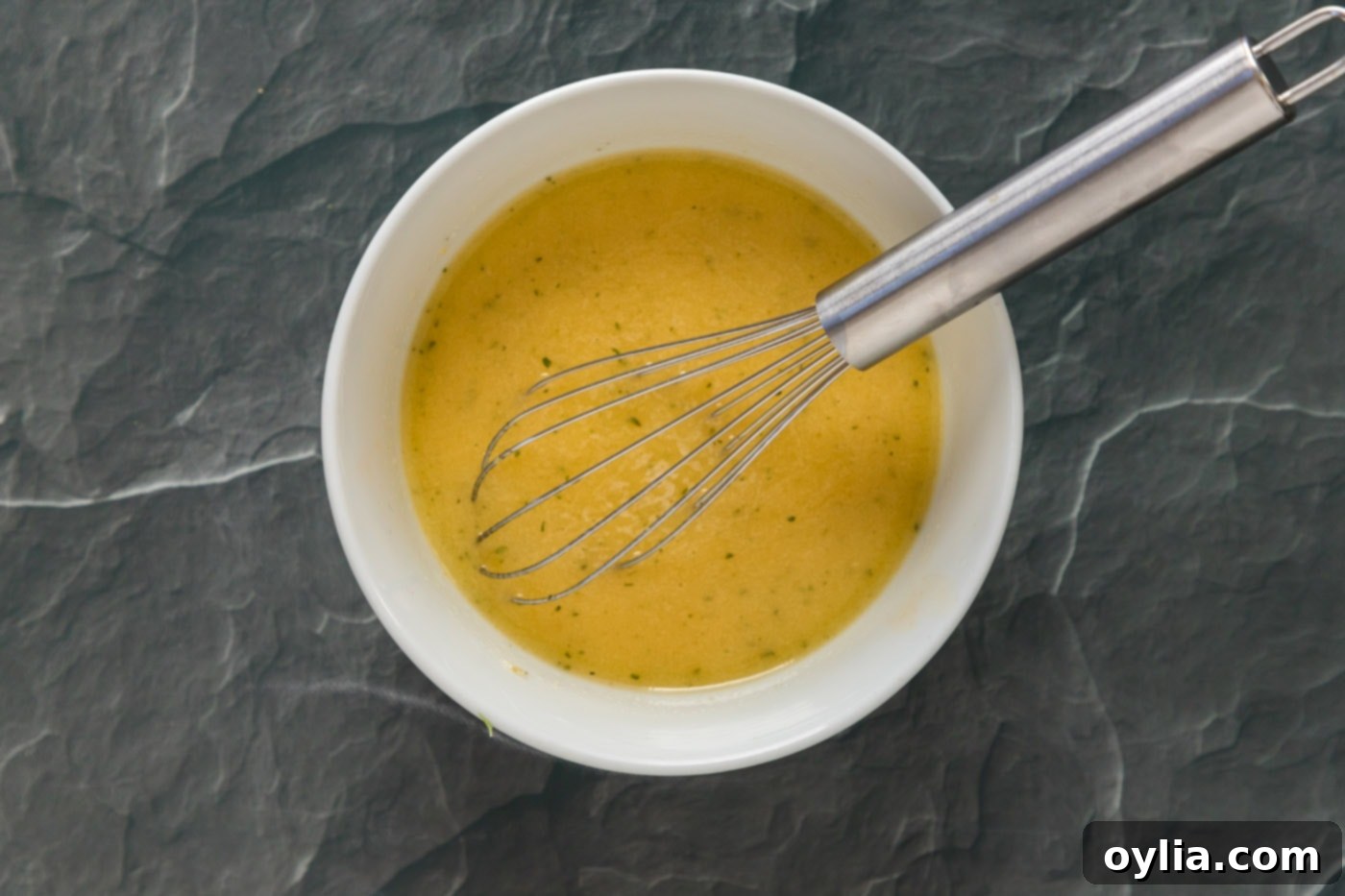 whisked butter, mandarin juice, garlic, and honey in a bowl