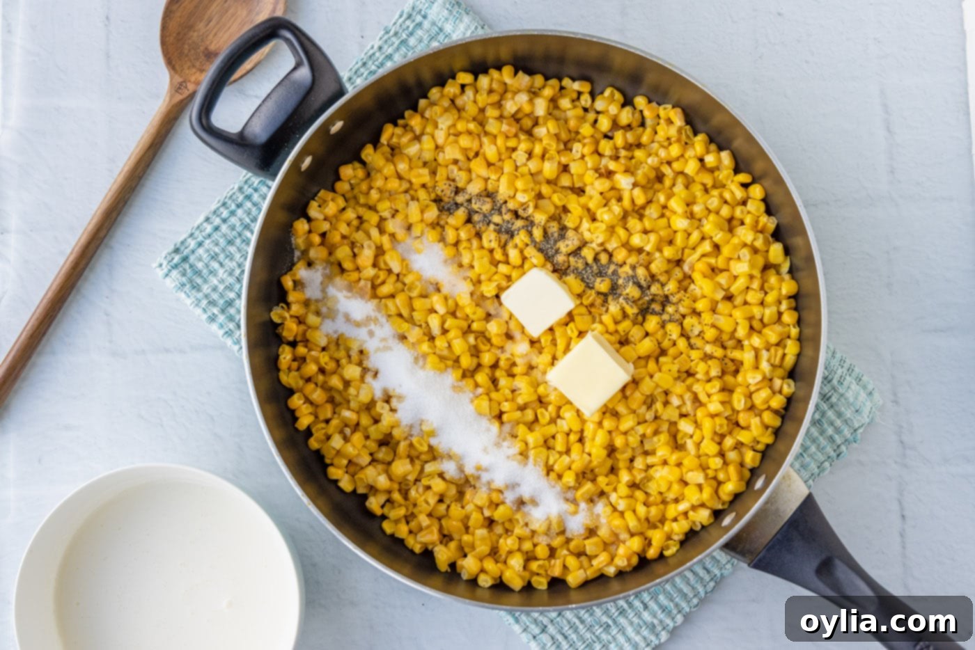 corn, butter, salt, and pepper in a skillet