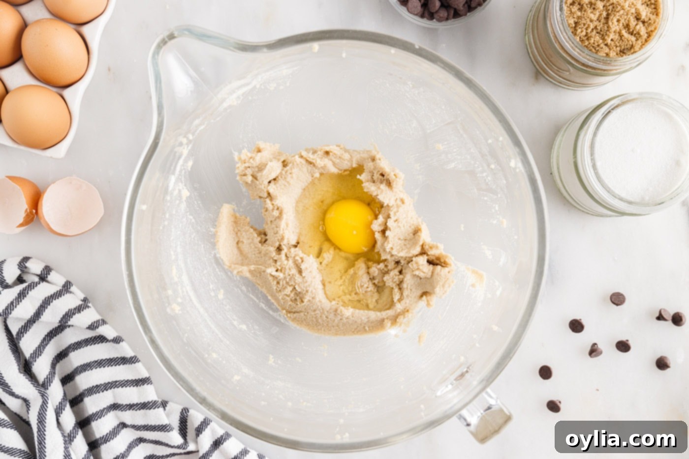 adding egg to cookie dough