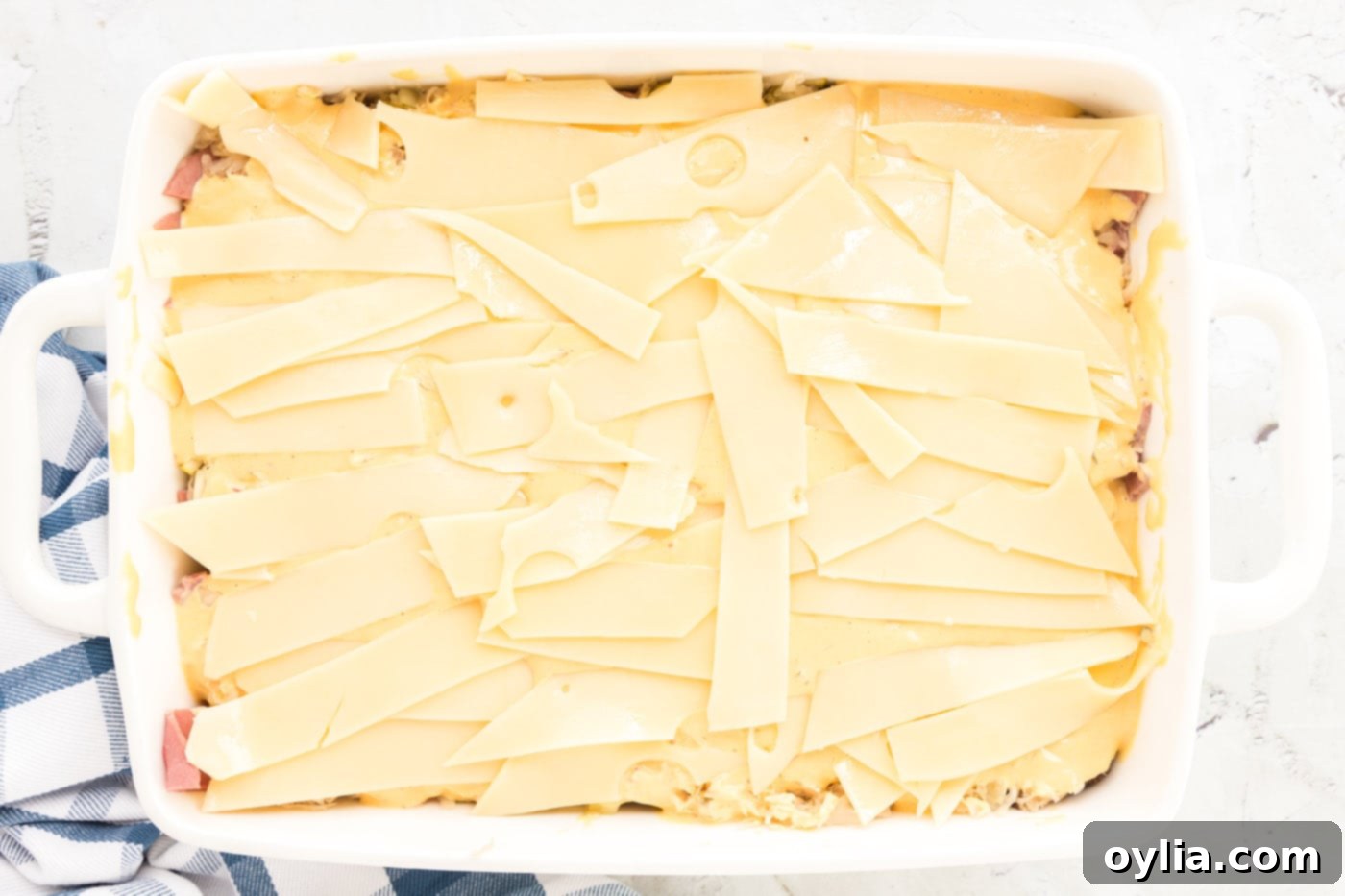 swiss cheese strips on top of thousand island dressing for reuben casserole