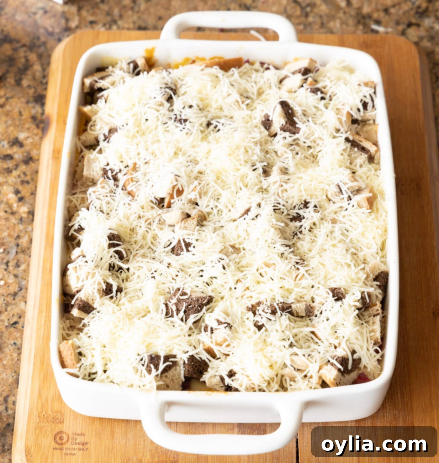 shredded Swiss cheese on top of reuben casserole