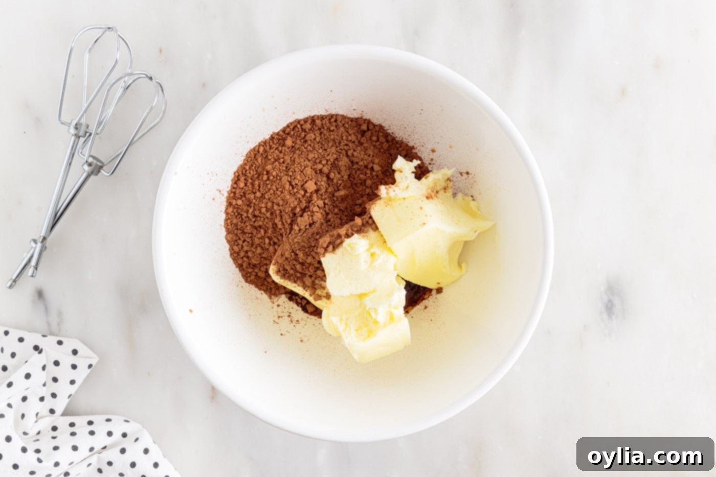 butter and cocoa powder in a mixing bowl