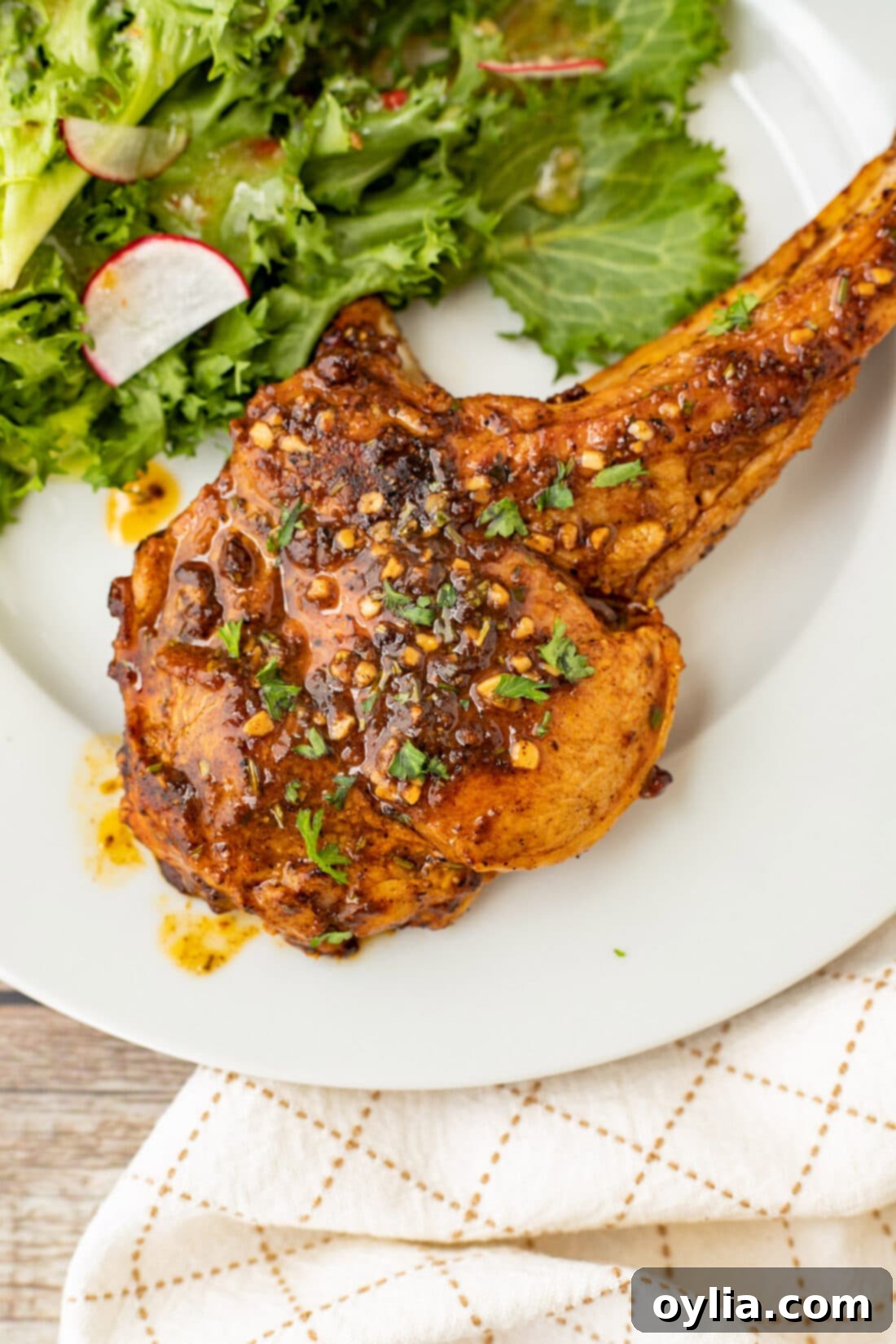 Veal Chop on a plate with salad