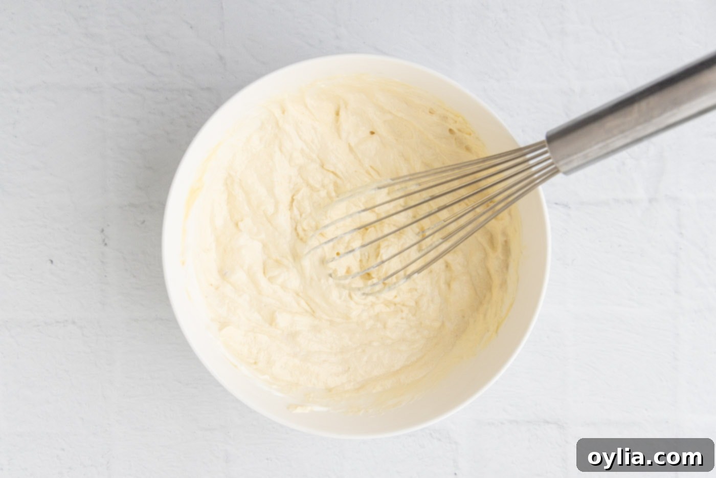 whisked cream of chicken soup and sour cream in a bowl