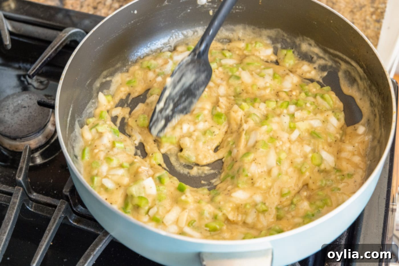 mixing gravy for shrimp etouffee in a skillet