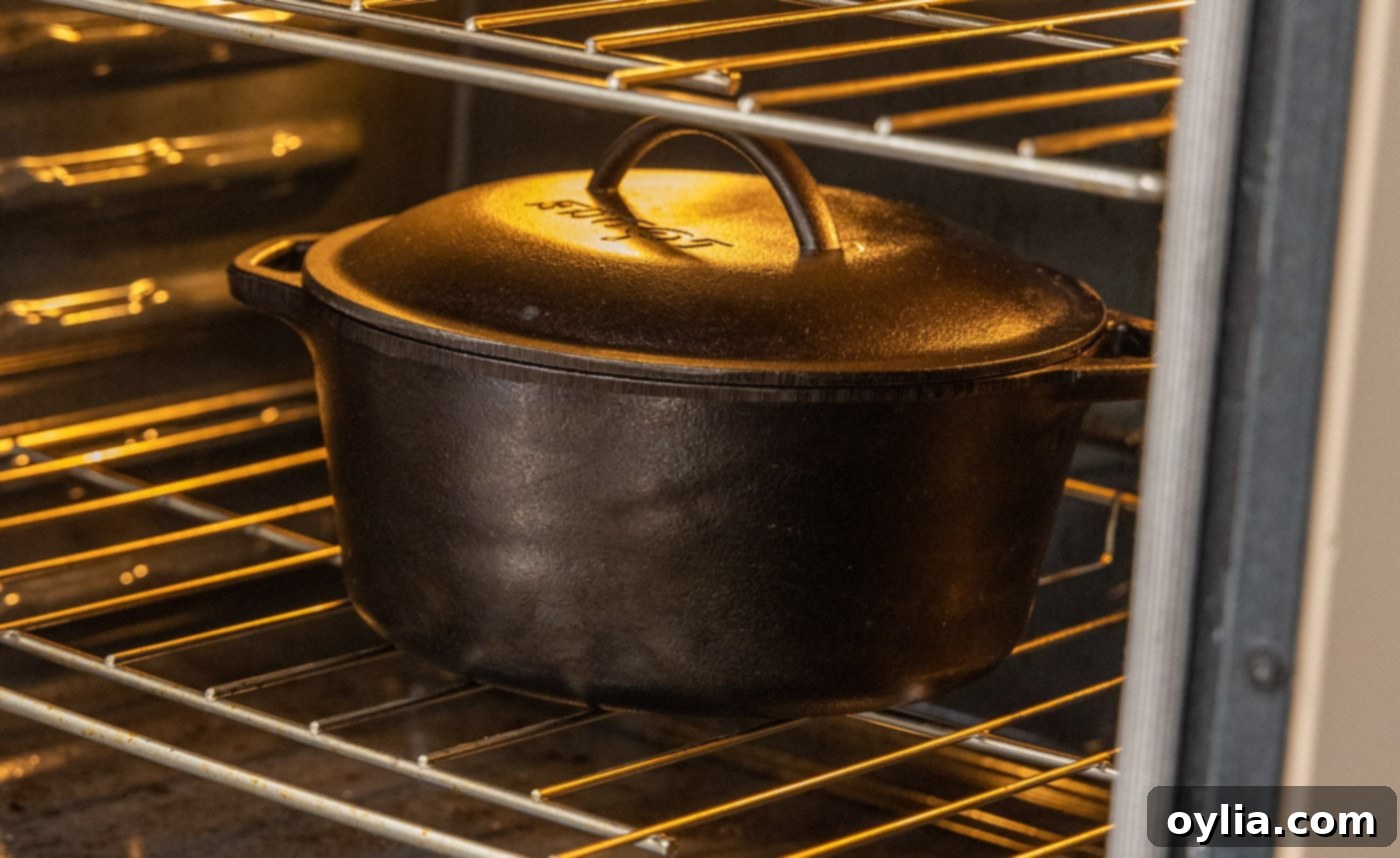 Dutch oven with veal osso buco braising inside a warm oven
