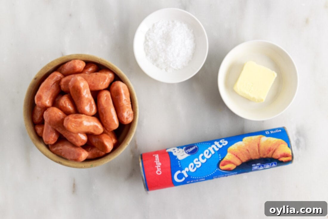 Snug Sausages 4 ingredients for Pigs in a Blanket laid out on a table