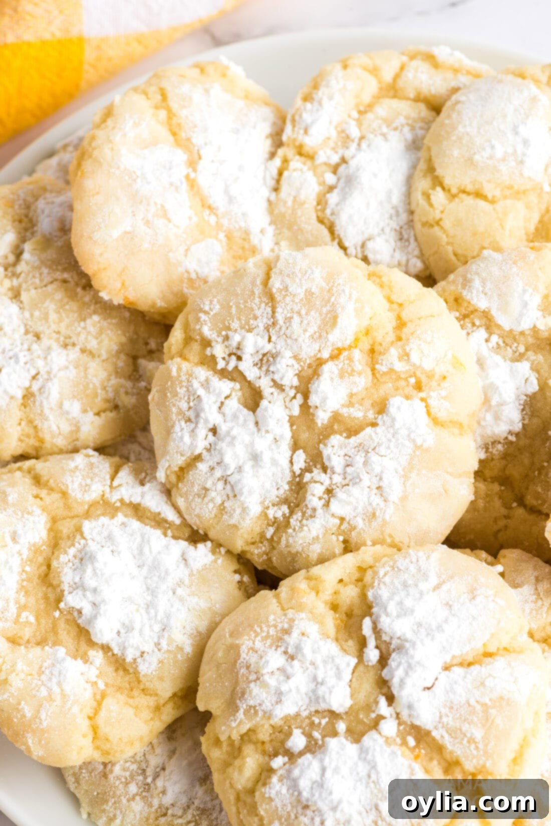 A festive plate filled with numerous perfectly baked orange crinkle cookies, ready to be served or gifted.