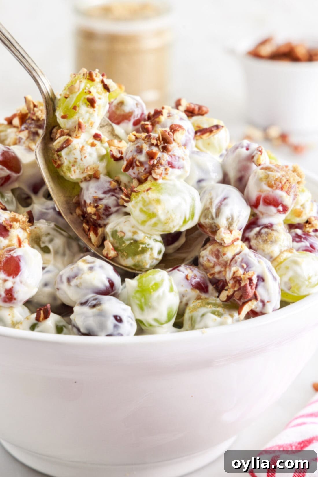 spoon lifting Grape Salad