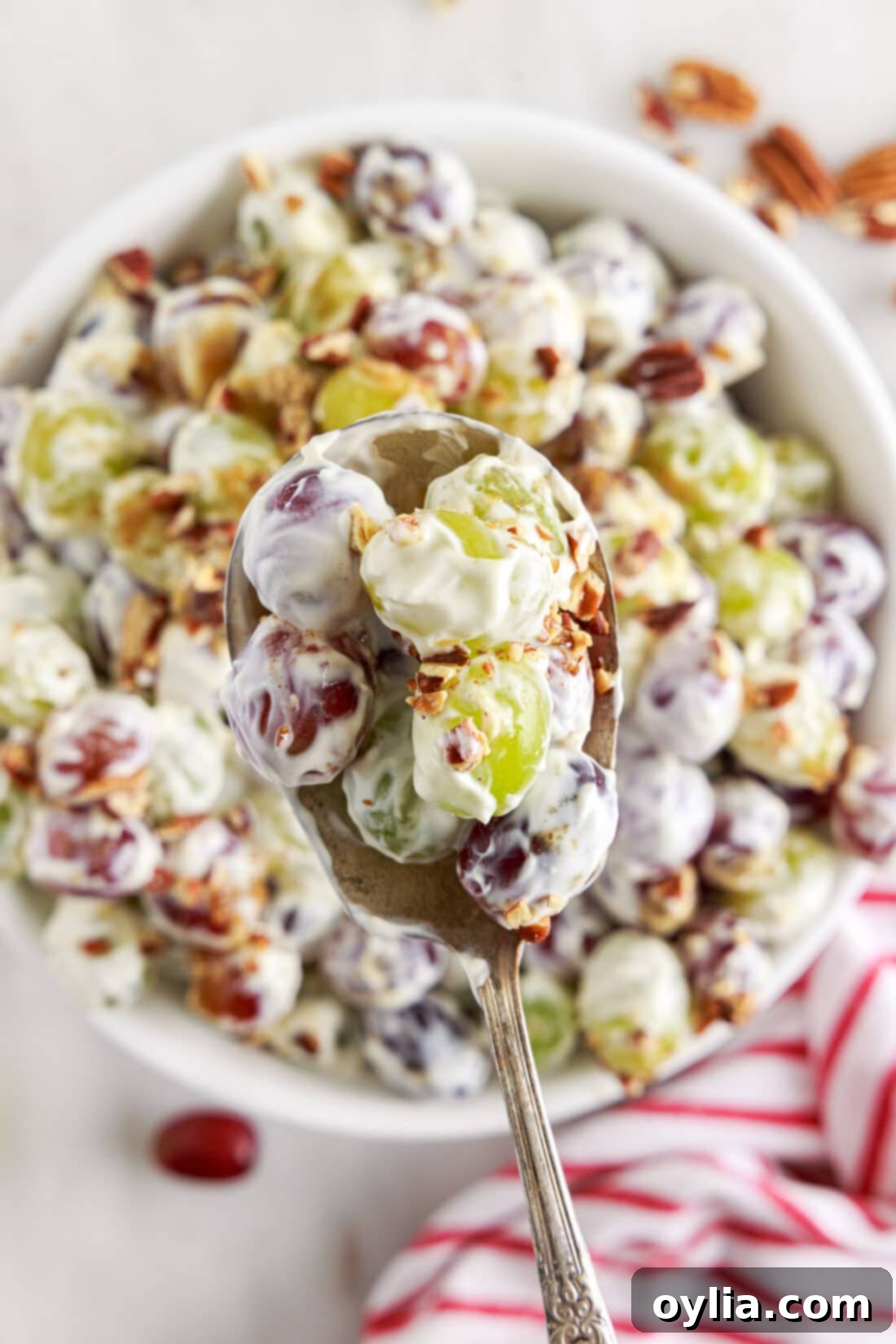 spoon of Grape Salad mover a bowl