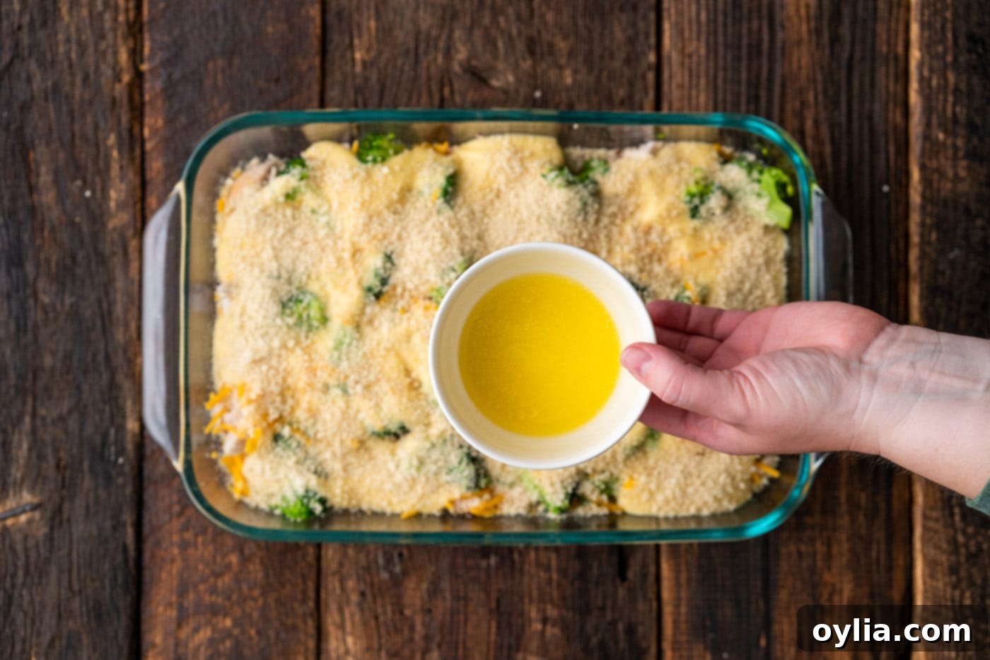 drizzling butter over chicken divan casserole