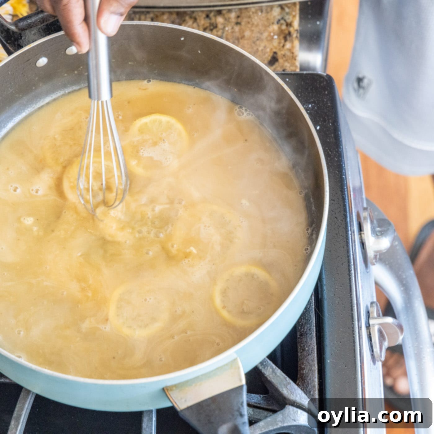 whisking butter and flour pan sauce with lemon