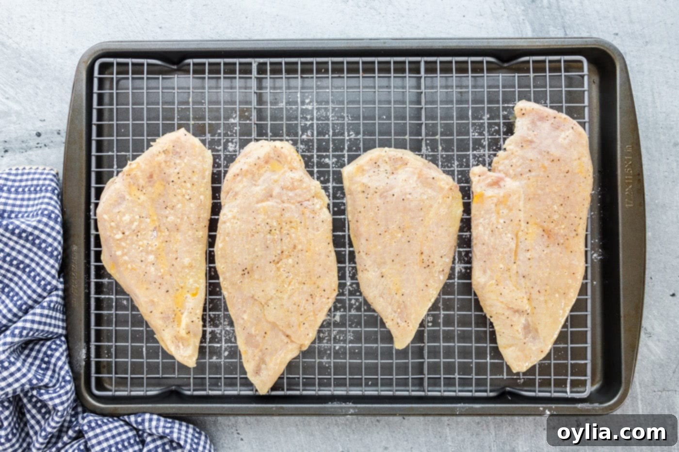 chicken breasts dredged in flour and egg