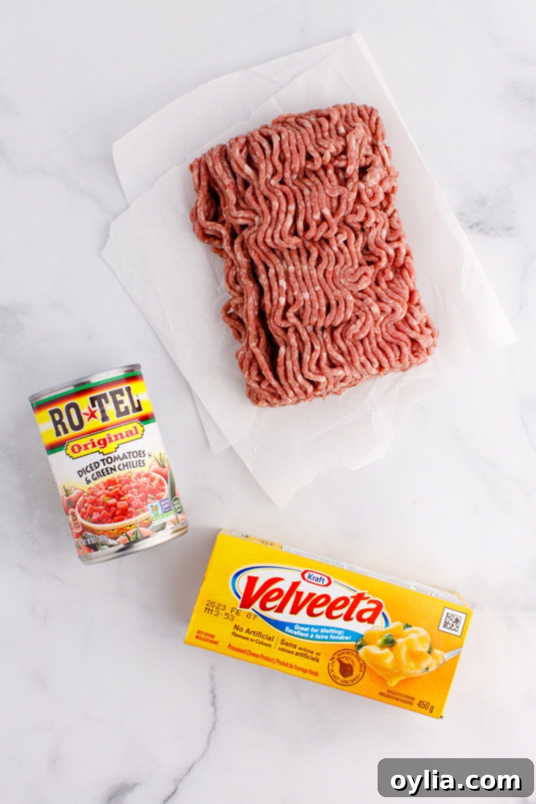 Creamy Chili Cheese Dip 4 The three main ingredients for Rotel Dip: ground beef, Velveeta cheese, and a can of Rotel tomatoes