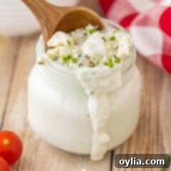Blue Cheese Dressing in a glass jar, ready to be served or stored.