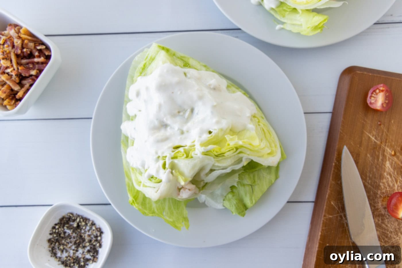 bleu cheese dressing on top of wedge salad