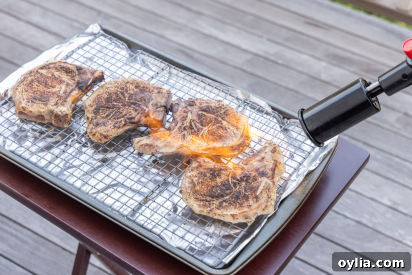 searing pork chops with a kitchen torch