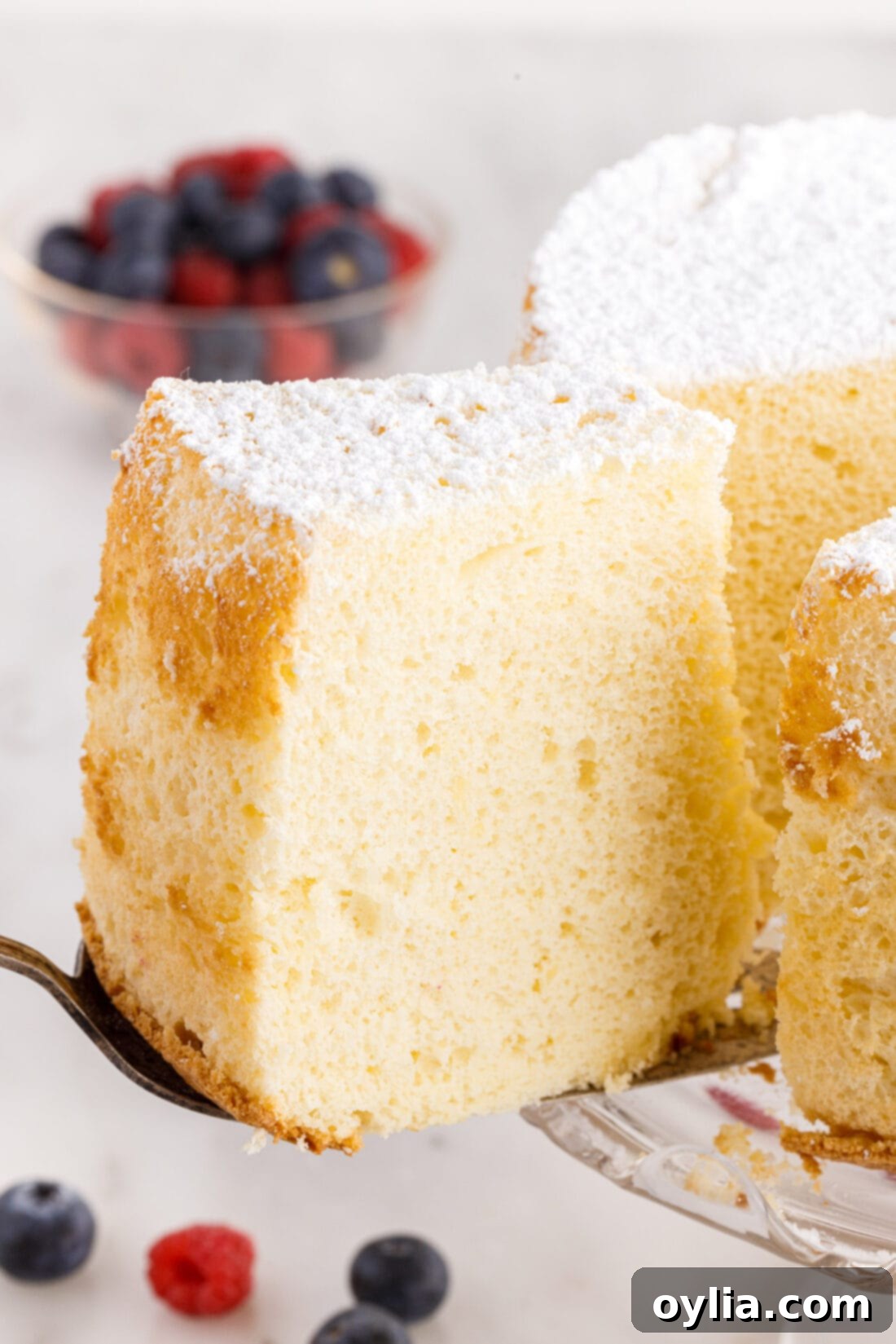 Slice of incredibly soft and fluffy Chiffon Cake on a spatula, ready to be served