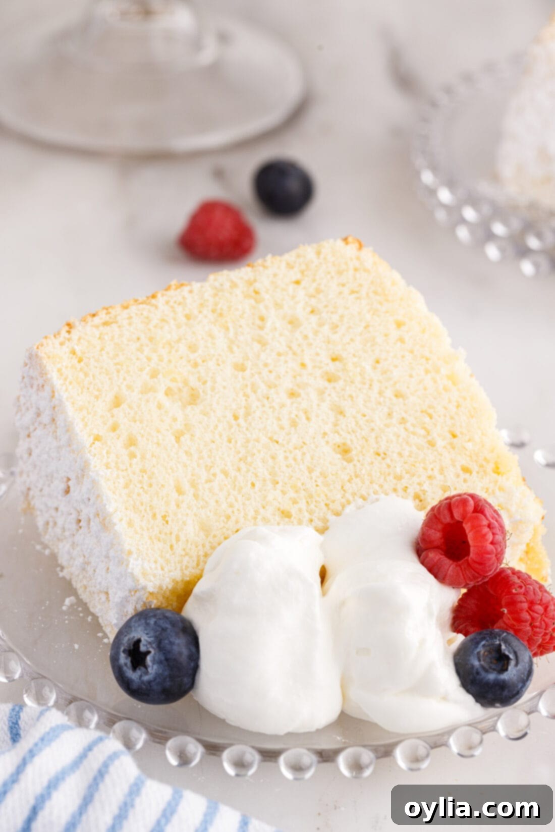 A beautiful, tall Chiffon Cake served on a platter, ready to be enjoyed