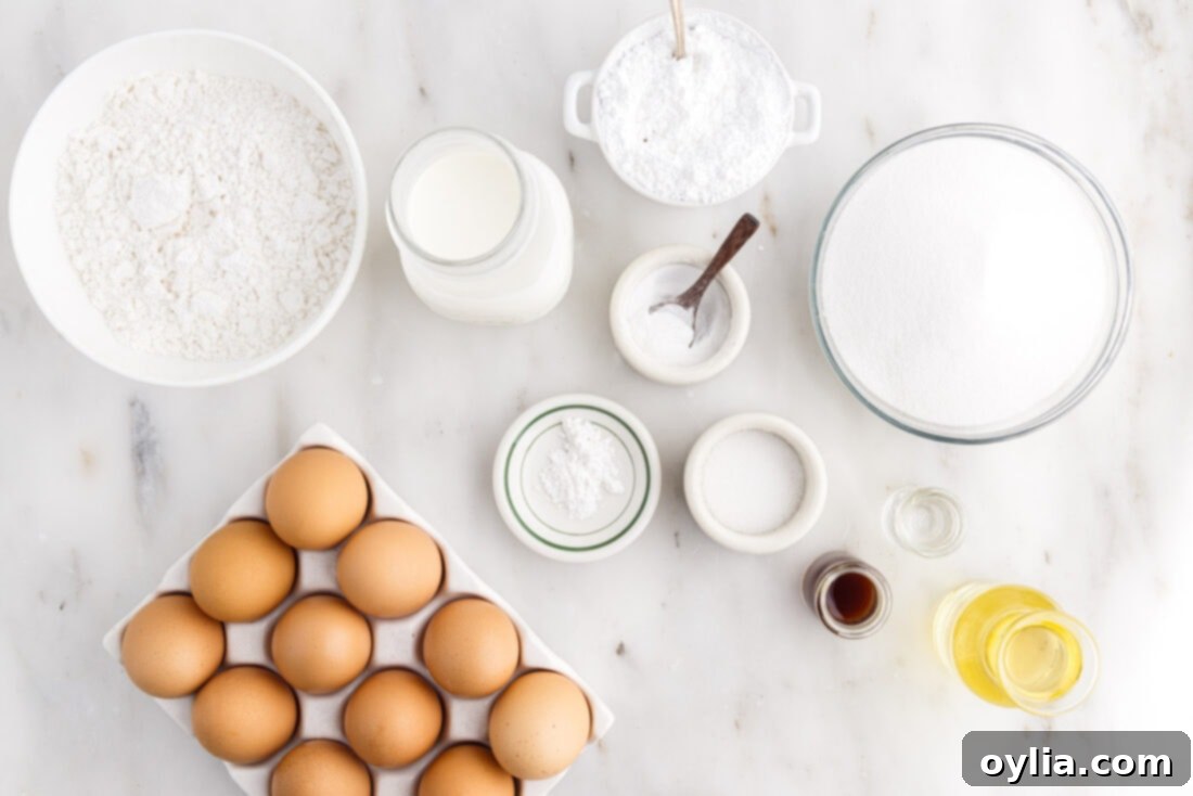 Arrangement of fresh ingredients for baking a Chiffon Cake, including flour, eggs, oil, and extracts