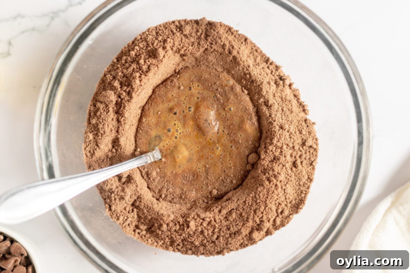 beaten eggs in the center of chocolate cake mix