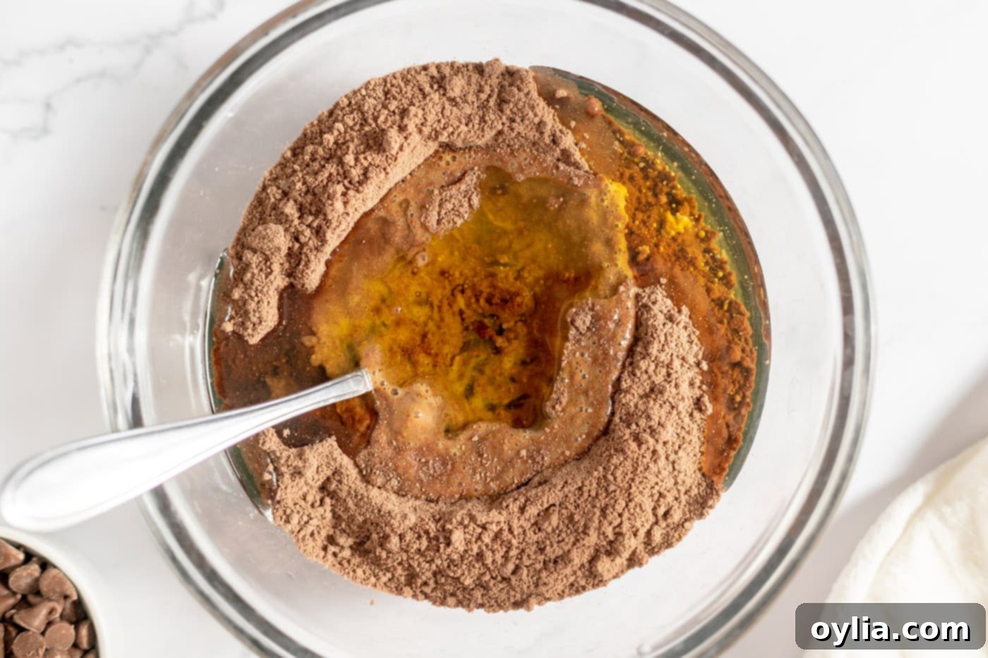 oil and eggs added to cake mix in a bowl