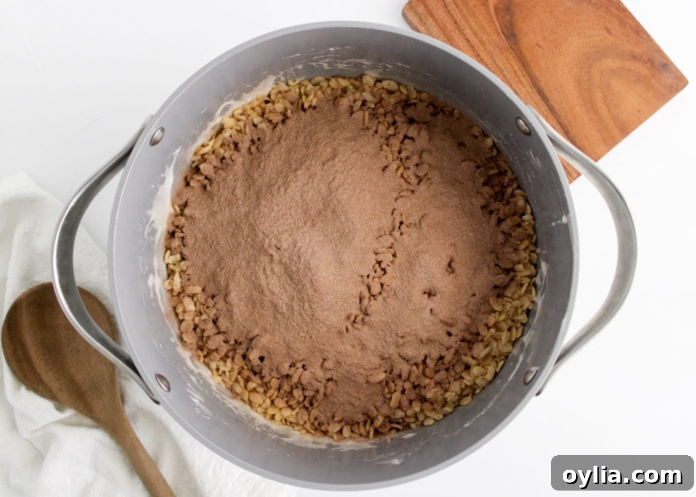 adding hot chocolate mix to rice krispies