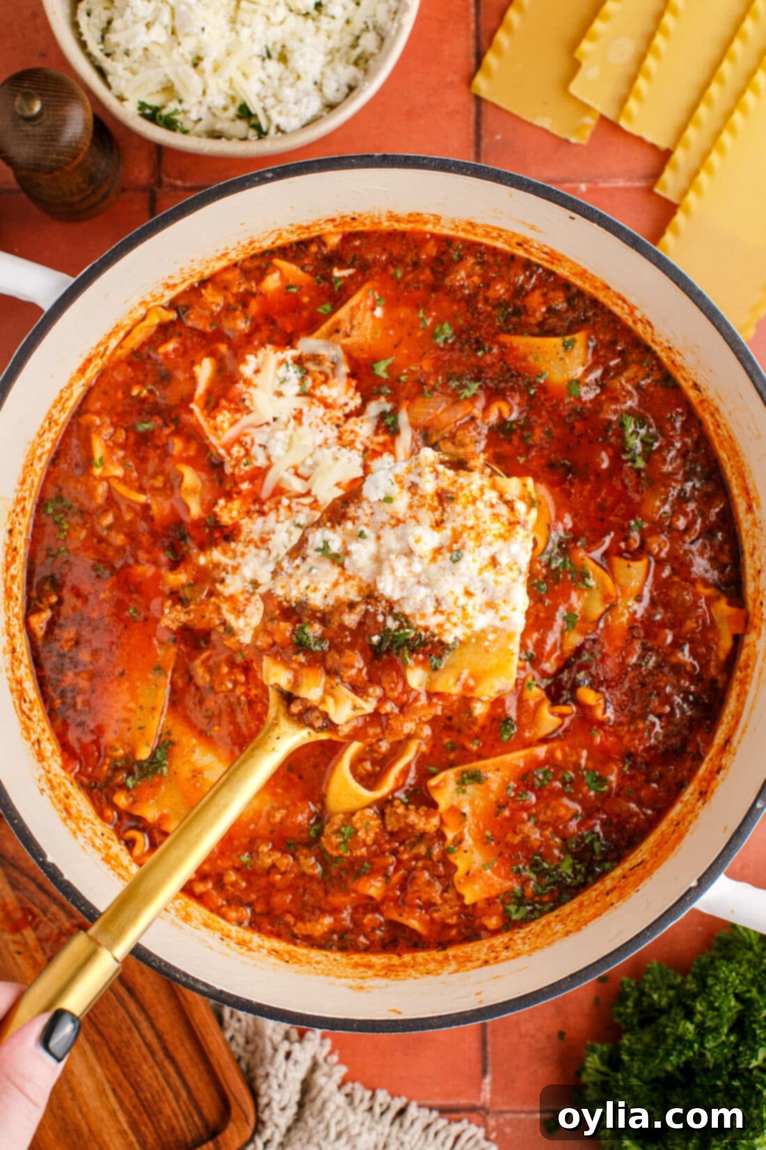 Spoonful of Lasagna Soup over pot of Lasagna Soup